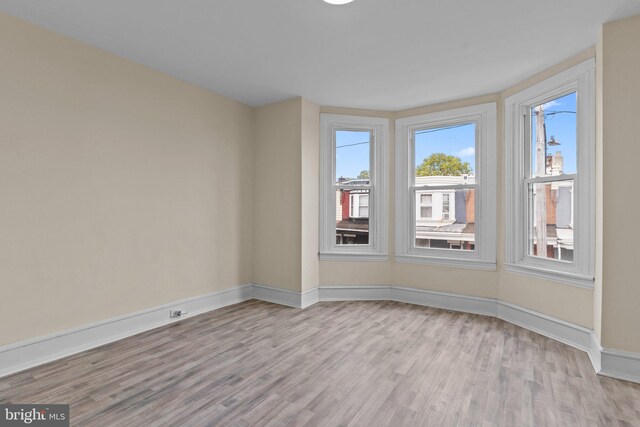 spare room featuring light hardwood / wood-style flooring