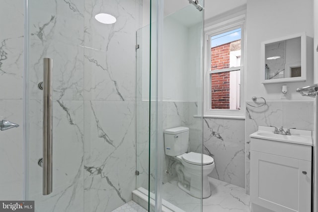 bathroom with tile walls, walk in shower, vanity, and toilet