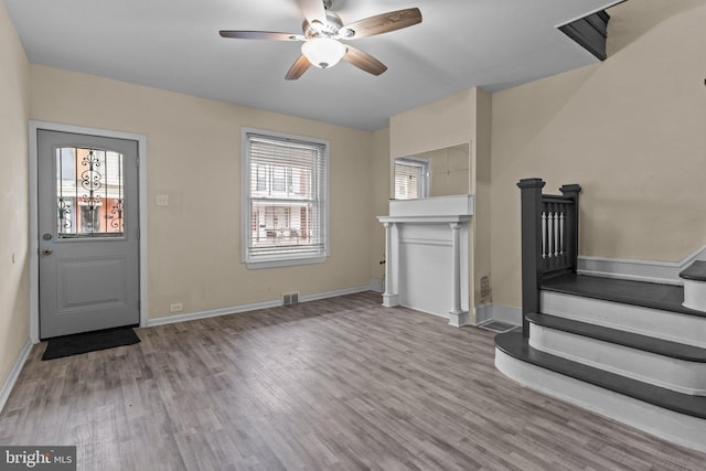 entrance foyer featuring light hardwood / wood-style flooring and ceiling fan