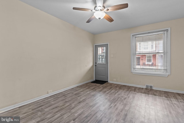 unfurnished room featuring light hardwood / wood-style flooring and ceiling fan