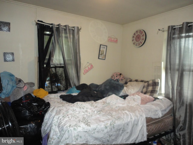 bedroom featuring crown molding