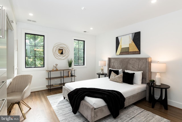 bedroom with wood-type flooring