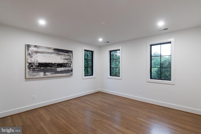 spare room featuring hardwood / wood-style floors