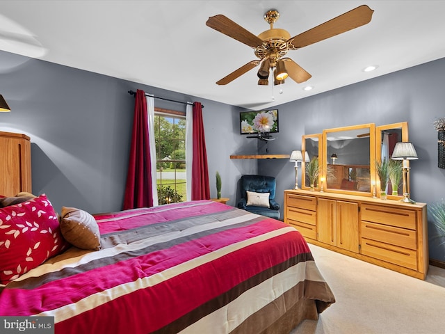 bedroom featuring ceiling fan and light colored carpet