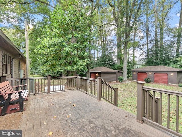 deck with a lawn and an outbuilding