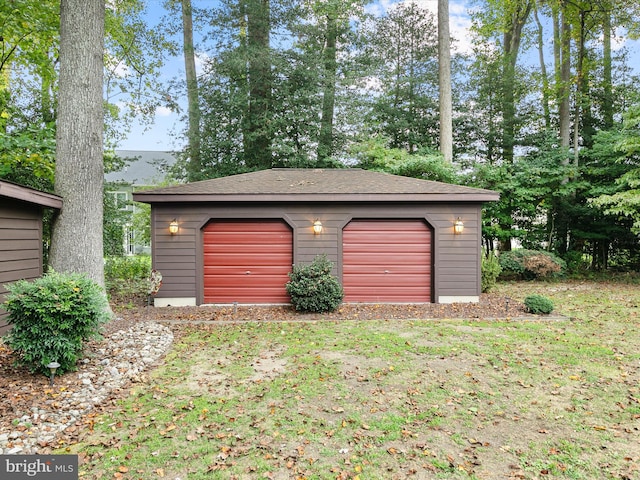 garage featuring a yard