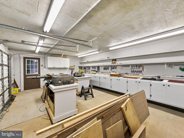 kitchen featuring a kitchen island and white cabinetry