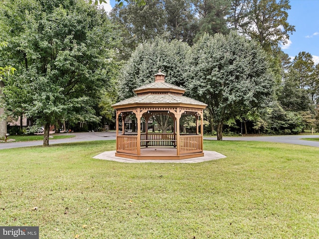 view of property's community featuring a lawn and a gazebo