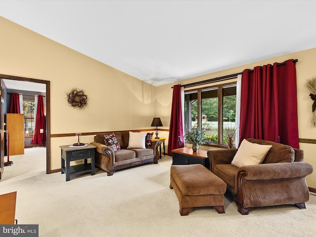 living room featuring light carpet