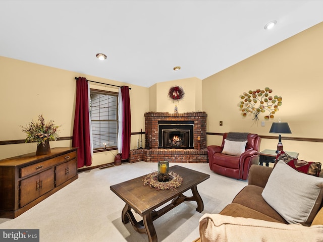 carpeted living room featuring a brick fireplace