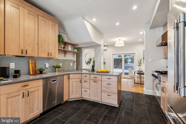 kitchen featuring dark hardwood / wood-style floors, light brown cabinets, sink, kitchen peninsula, and premium appliances