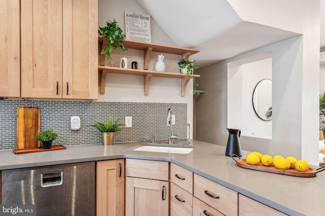 kitchen featuring decorative backsplash, light brown cabinetry, and sink