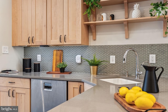 kitchen featuring decorative backsplash, light brown cabinets, and sink