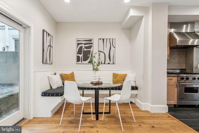 dining room with hardwood / wood-style floors and breakfast area