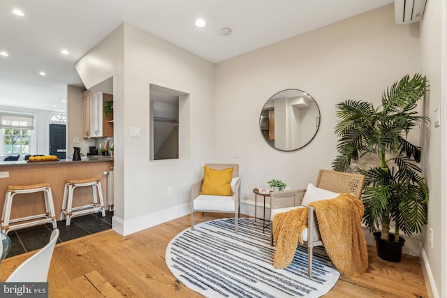 living area with wood-type flooring