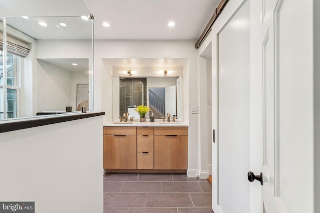 bathroom featuring tile patterned flooring and vanity