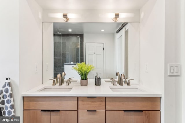 bathroom featuring vanity and a tile shower