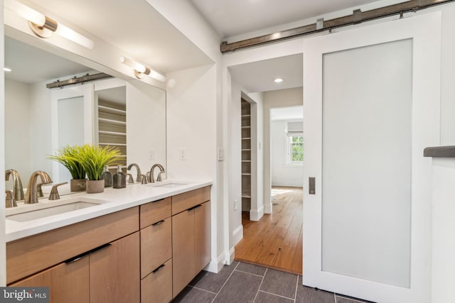 bathroom featuring vanity and hardwood / wood-style floors