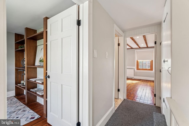 hall with hardwood / wood-style flooring