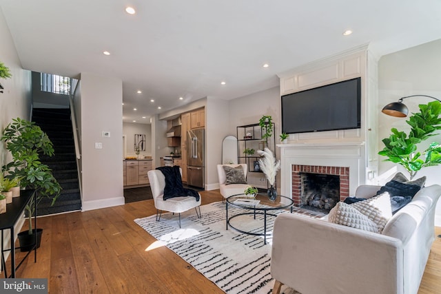 living room featuring a fireplace and light hardwood / wood-style floors