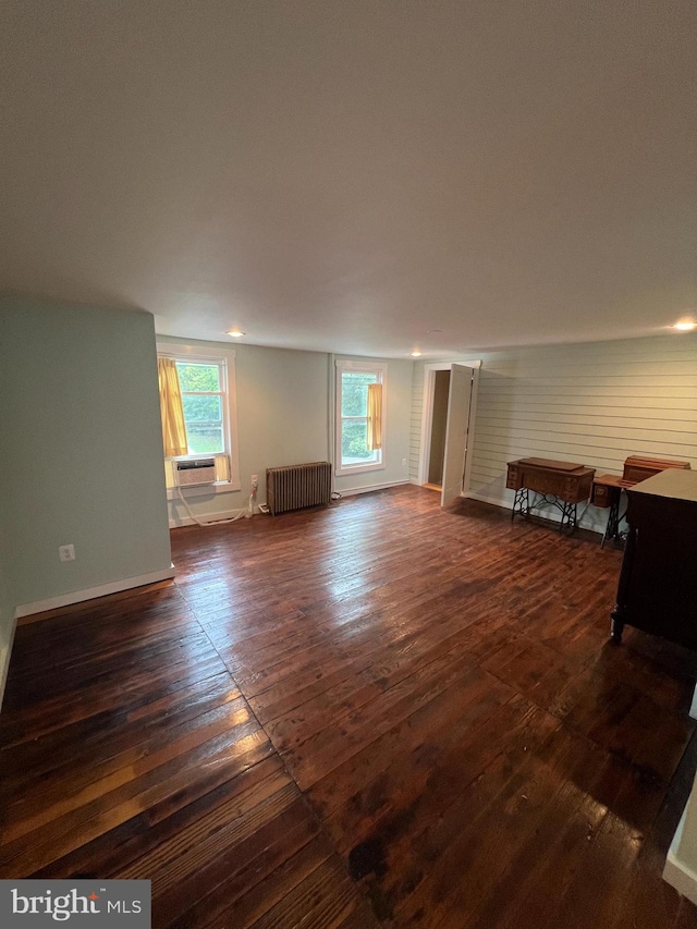 interior space with radiator and dark wood-type flooring