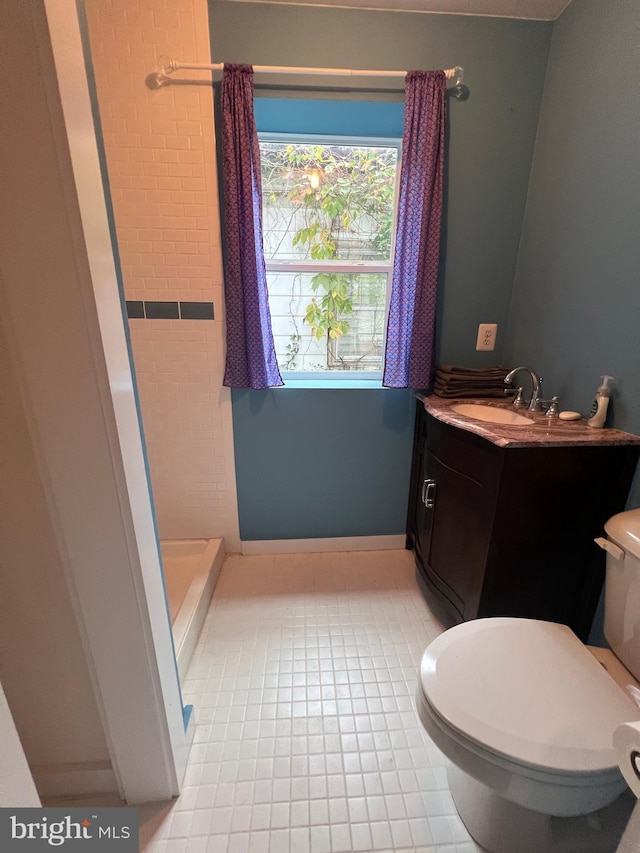 bathroom with vanity, toilet, tile patterned floors, and a shower with shower curtain