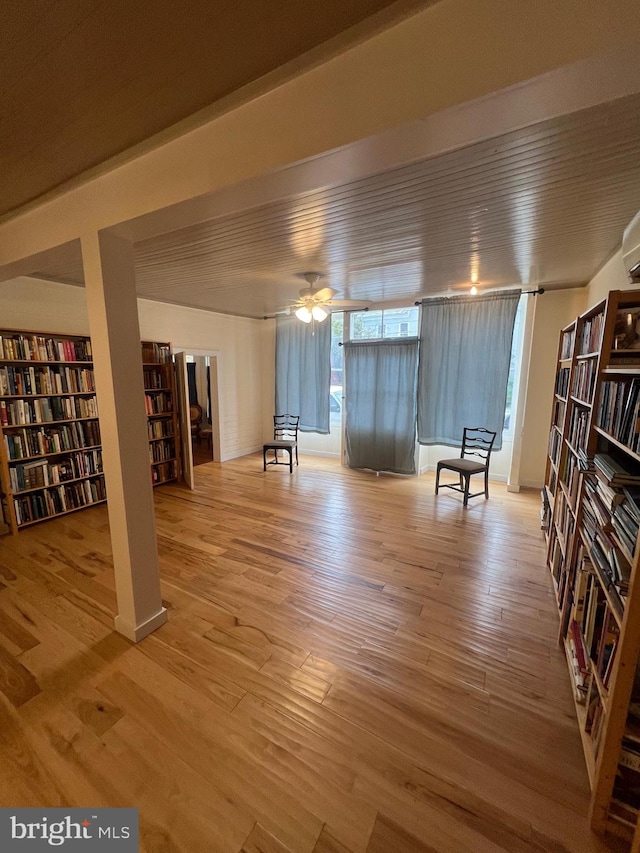 unfurnished room with ceiling fan and light wood-type flooring