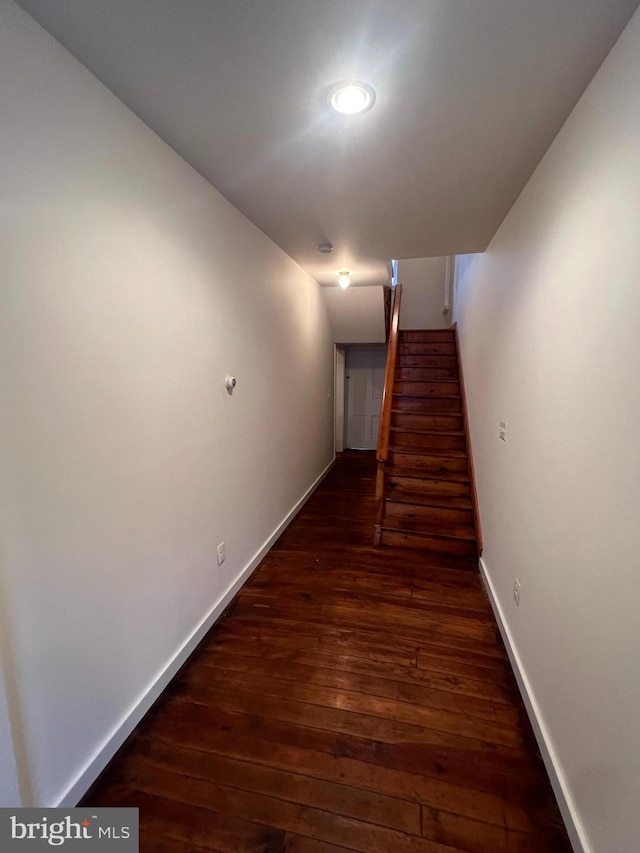 hall with dark hardwood / wood-style floors