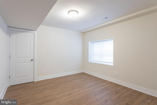 empty room with light hardwood / wood-style floors