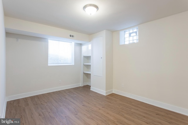 basement featuring light hardwood / wood-style flooring