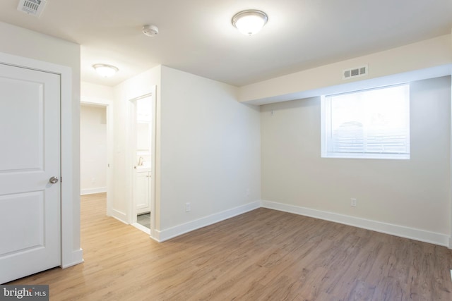 unfurnished room featuring light hardwood / wood-style floors