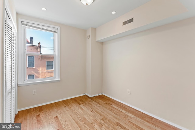 unfurnished room featuring light hardwood / wood-style floors