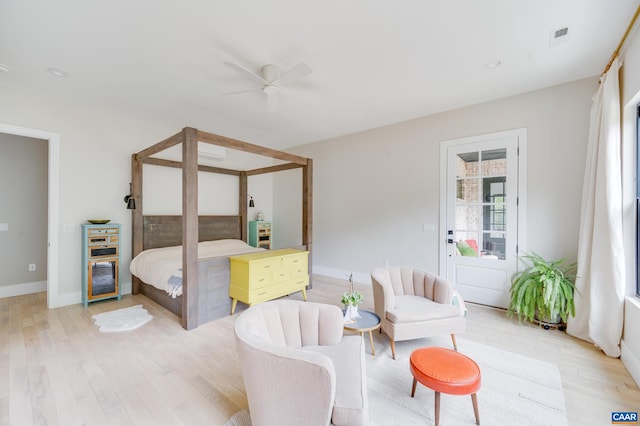 bedroom with ceiling fan and light wood-type flooring