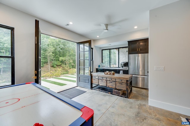 rec room featuring ceiling fan and plenty of natural light