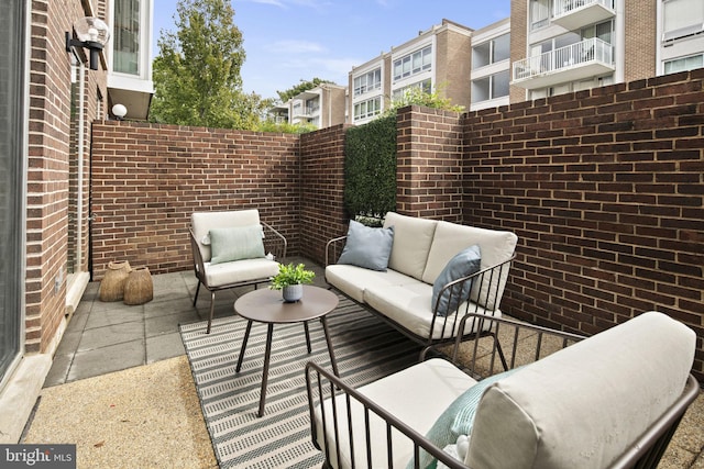 view of patio / terrace with a balcony