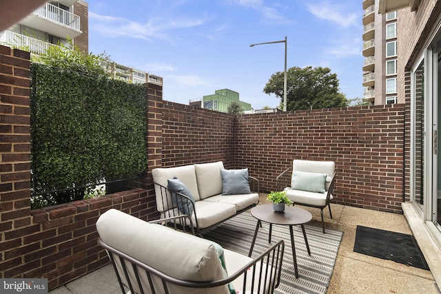 view of patio / terrace featuring a balcony and outdoor lounge area