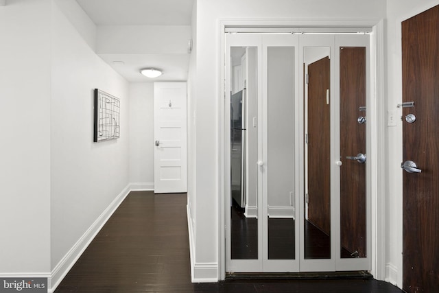 hall with dark wood-type flooring