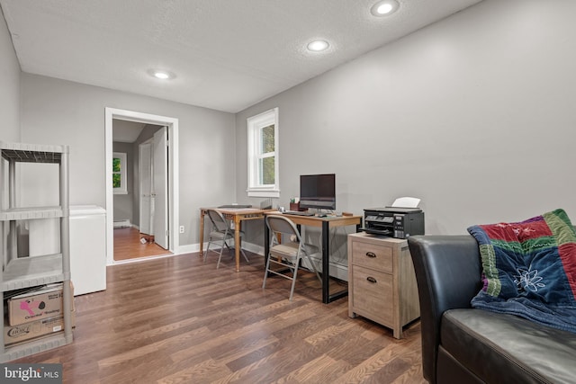 office with dark hardwood / wood-style floors and a textured ceiling