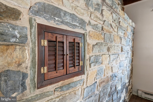 utility room featuring a baseboard radiator