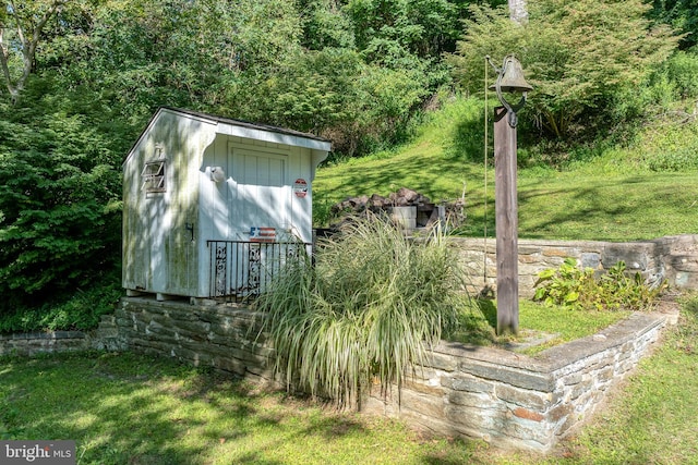 view of outbuilding with a lawn