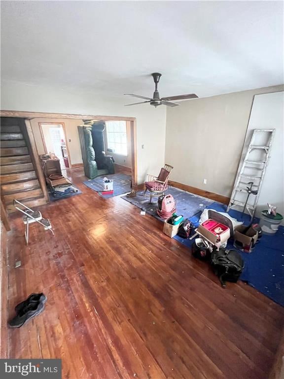 interior space with ceiling fan and hardwood / wood-style floors