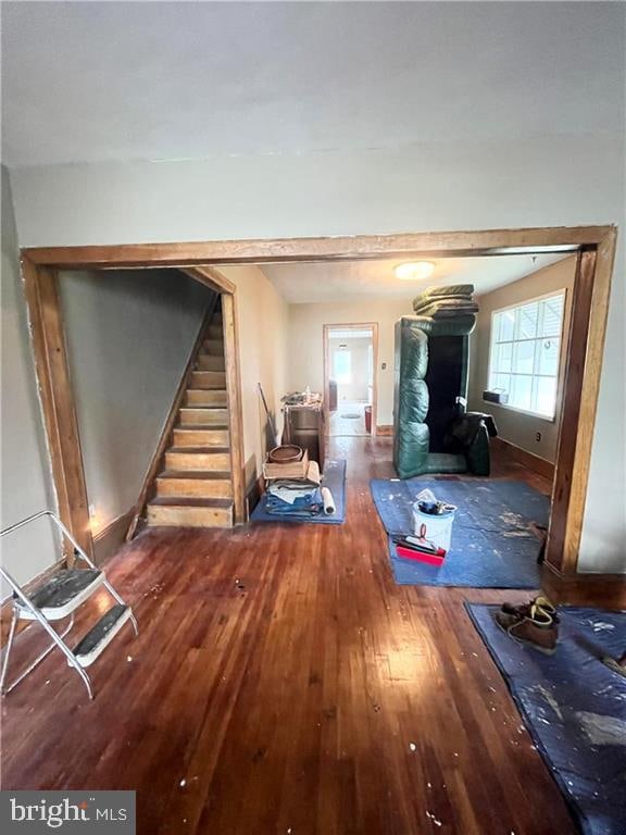 hall with dark hardwood / wood-style flooring