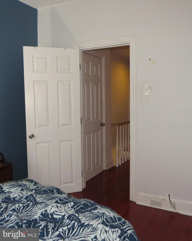 bedroom featuring dark hardwood / wood-style floors