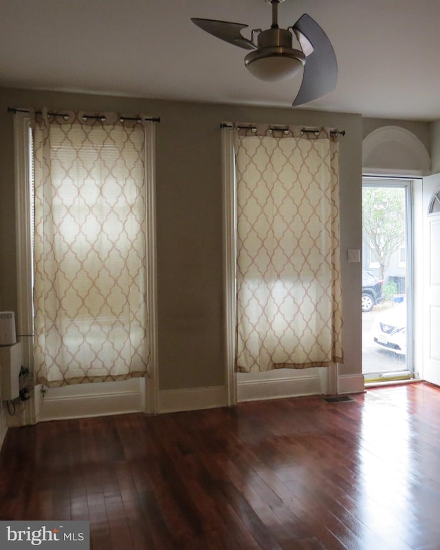 foyer with ceiling fan and hardwood / wood-style floors