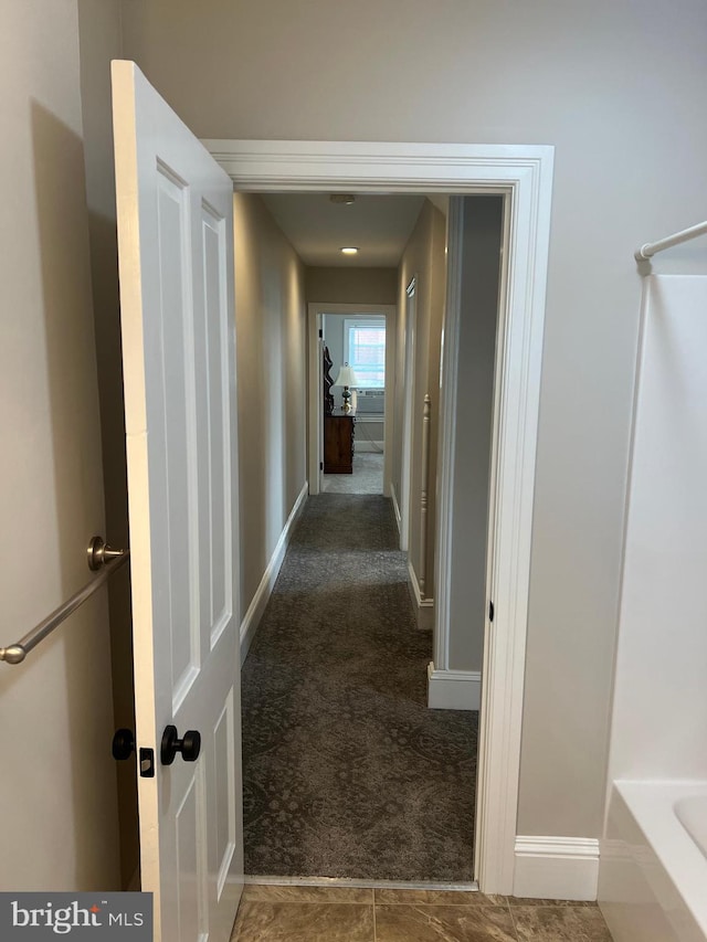 corridor with carpet floors