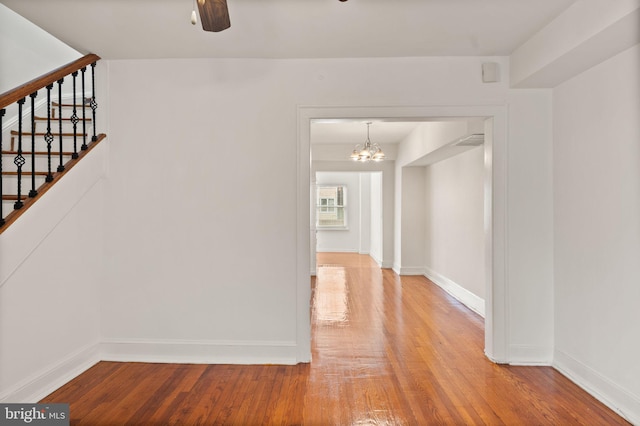 interior space with an inviting chandelier and hardwood / wood-style flooring