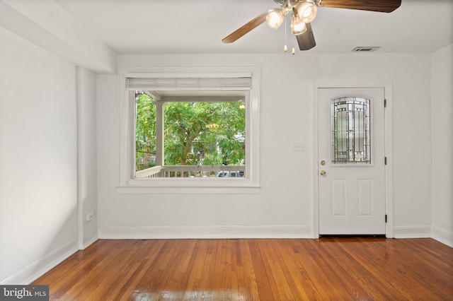 entryway with ceiling fan and hardwood / wood-style flooring