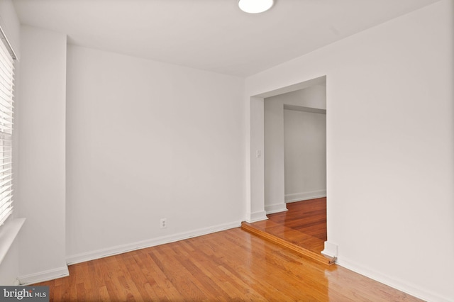 unfurnished room featuring wood-type flooring