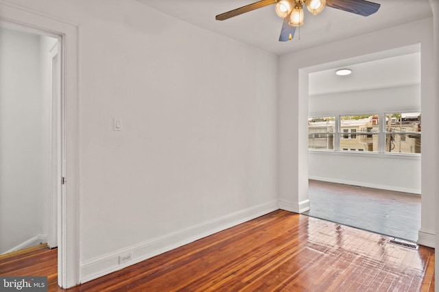 empty room featuring ceiling fan and hardwood / wood-style floors