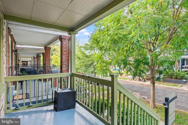 balcony featuring a porch